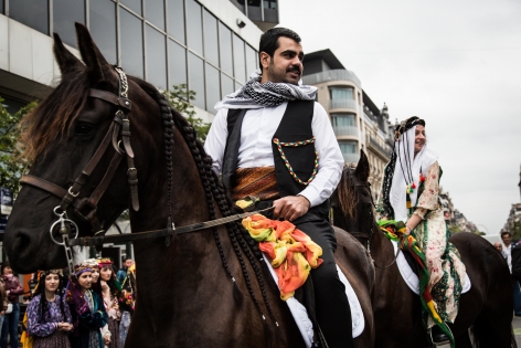 AB392436 On the occasion of the 2nd edition of the Kurdish Cultural Week in Brussels, a march with traditional costumes, music, and with a couple riding horses like done during weddings went through the center of the city.