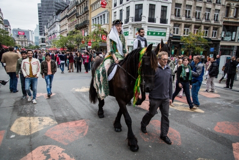 AB392441 On the occasion of the 2nd edition of the Kurdish Cultural Week in Brussels, a march with traditional costumes, music, and with a couple riding horses like done during weddings went through the center of the city.